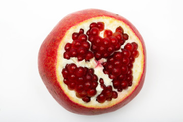 Juicy ripe pomegranate on white background. Pomegranate seeds