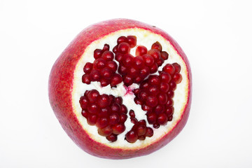 Juicy ripe pomegranate on white background. Pomegranate seeds