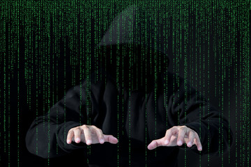 Asian hacker in black hood on black background,Hack password,hacking safety systems to steal information