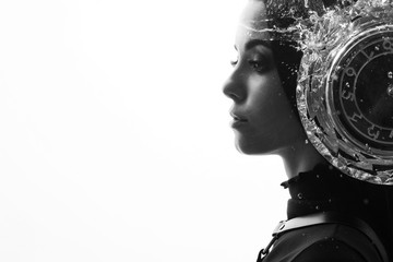 Double exposure of a female face, clock and water. Abstract black and white woman portrait. Digital...