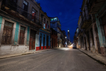Street view of the residential neighborhood in the Old Havana City, Capital of Cuba, during night time after sunset.