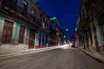 Fototapeta na wymiar Street view of the residential neighborhood in the Old Havana City, Capital of Cuba, during night time after sunset.