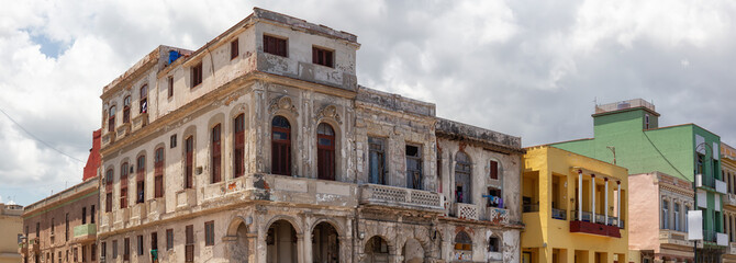 Panoramic View of the ancient residential homes in the Old Havana City, Capital of Cuba, during a cloudy and sunny day.