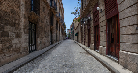 Fototapeta na wymiar Panoramic Street view of the Old Havana City, Capital of Cuba, during a bright and sunny day.