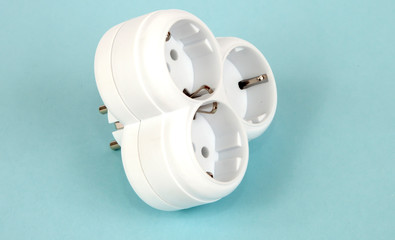 Isolated triple plug adapter on white background. Studio shot object