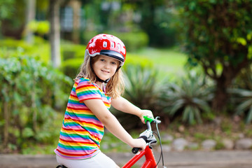 Fototapeta na wymiar Kids on bike. Child on bicycle. Kid cycling.