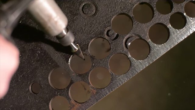 machining a hole with a burr in a metal part