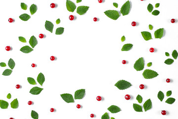 Fruit pattern made of fresh berries, green leaves and frame on white background. Concept of healthy food. Flat lay, top view, copy space
