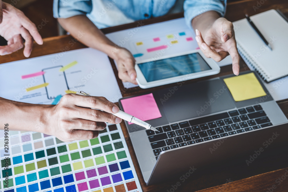 Poster team of creative web/graphic designer planning, drawing website ux app for mobile phone application 