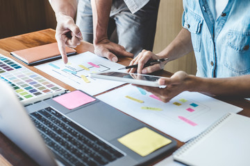 Team of Creative Web/Graphic Designer planning, drawing website ux app for mobile phone application and development template layout, process to developing prototype wireframe, User experience concept