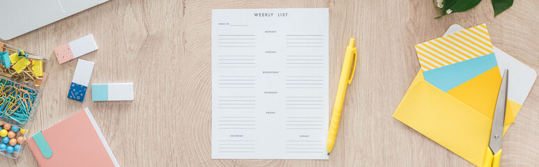 panoramic view of weekly list and stationery on wooden table - obrazy, fototapety, plakaty