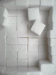 White sugar cubes stacked neatly in a package