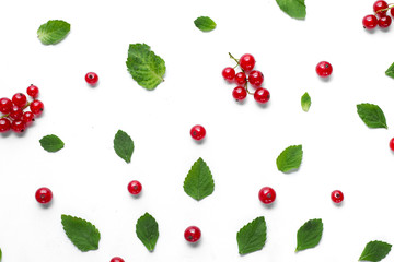 Fruit pattern made of fresh berries and green leaves on white background. Concept of healthy food. Flat lay, top view, copy space