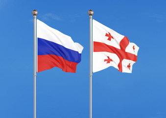 Russia vs Georgia. Thick colored silky flags of Russia and Georgia. 3D illustration on sky background. – Illustration