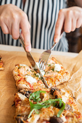 woman eating pizza in the restaurant