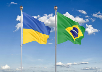 Ukraine vs Brazil. Thick colored silky flags of Ukraine and Brazil. 3D illustration on sky background. – Illustration
