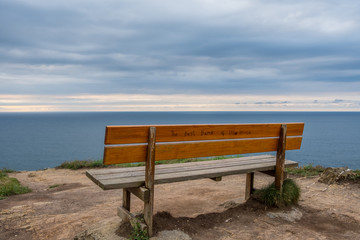 Fototapeta na wymiar Lonely bench, overlooking the cliffs
