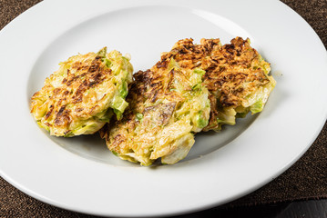 vegetable pancakes on the white plate