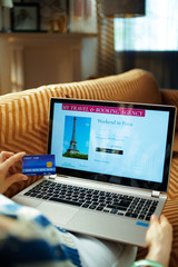 woman with credit card using online travel hotel booking site