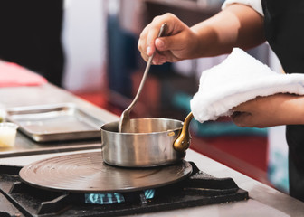 Chef preparing food in the kitchen, chef cooking