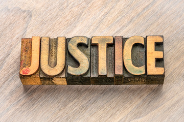 justice word in letterpress wood type