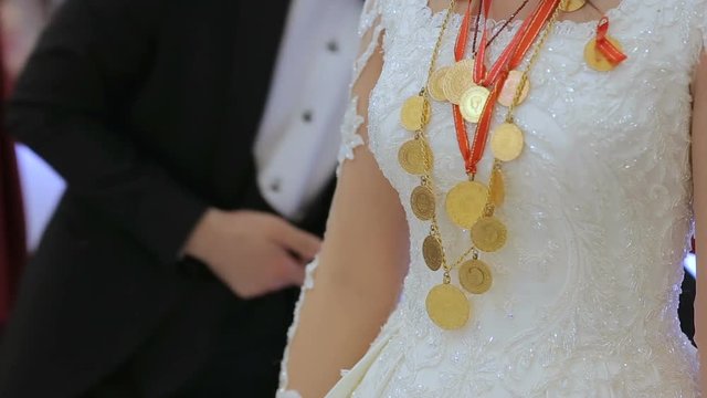 Golden Oriental Jewelry And Accessories on woman's body on wedding traditional ceremony. Female Hands With Turkish Jewellery.