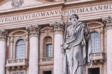 Rome, statue of St. Peter in Vatican. In background Basilica di San Peter.