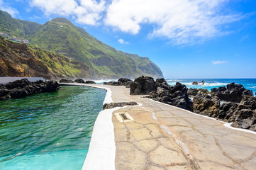 Natural volcanic swimming lagoon pools at Porto Moniz, travel destination for vacation, Madeira island, Portugal - obrazy, fototapety, plakaty