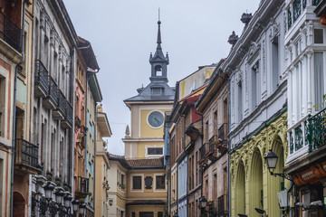 Fototapeta na wymiar Clock tower of City Hall seen from San Antonio Street in oldest part of Oviedo, Spain