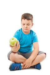 Fototapeta premium Fat boy and apple, sitting on floor. Isolated on white background