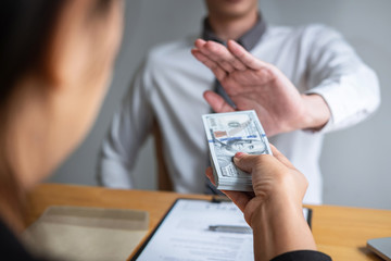 Anti bribery and corruption concept, Business man refusing and don't receive money banknote in...