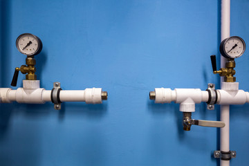 Manometers of center plumbing system with indicators of pressure  on the plastic  water pipes of...