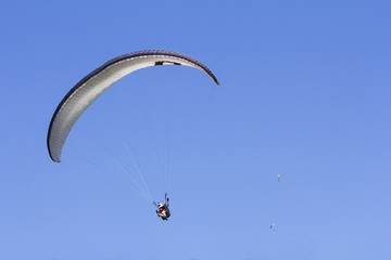 Paragliding in the blue sky as background extreme sport