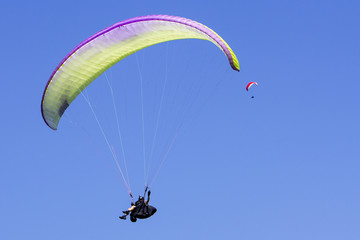 Paragliding in the blue sky as background extreme sport