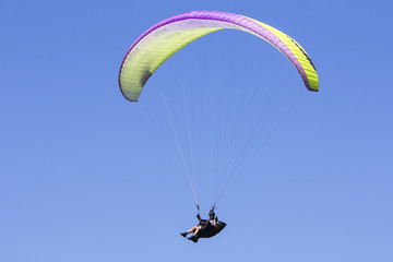 Paragliding in the blue sky as background extreme sport