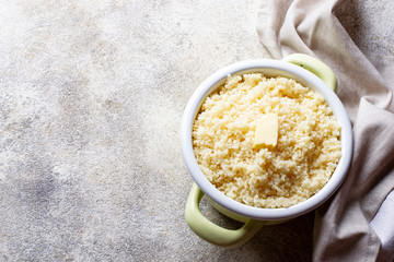 Couscous with butter in pot