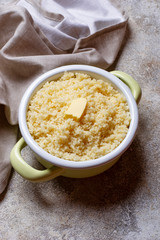 Couscous with butter in pot