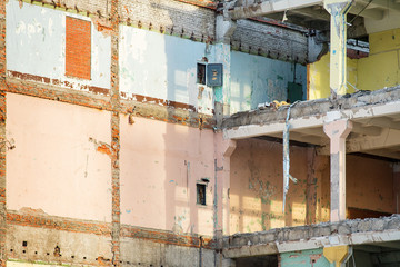 Naklejka premium Modern partially destroyed industrial building with colored walls