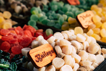 Colorful sugar sweets gums and jelly beans on market