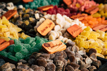 Colorful sugar sweets gums and jelly beans on market