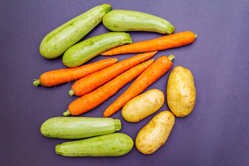 Fresh vegetables cooking black stone background