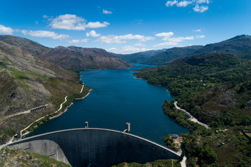 Obraz na płótnie Canvas Aerial scenic view of the Vilarinho das Furnas Dam at the Peneda Geres National Park, in Portugal.