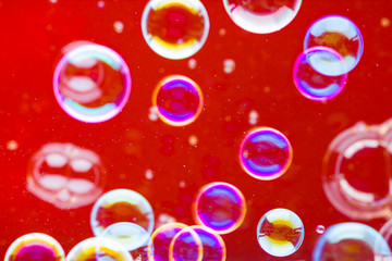 Abstract soap bubble background. Element for designers. Foam red bubble texture. Colorful bubbles float in the air