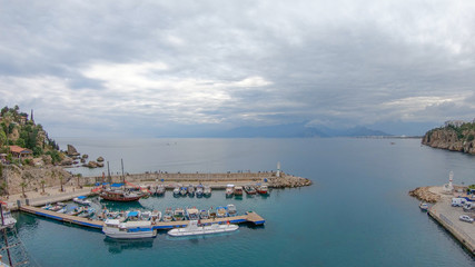Naklejka na ściany i meble View of the old Antalya from the height of the drone or bird's-eye view. This is the area of the old town and the old harbor.