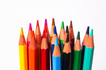 set of colored pencils on a white background