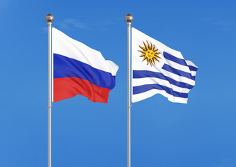 Russia vs Uruguay. Thick colored silky flags of Russia and Uruguay. 3D illustration on sky background. – Illustration