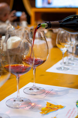 Professional wine tasting, sommelier course, cold rose and red dry wine in wine glasses