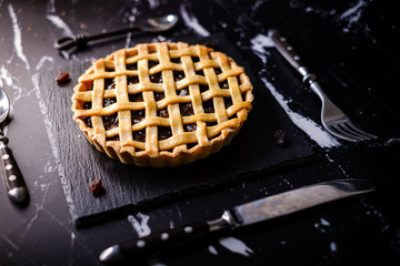 Homemade rustic pastry Traditional Raisin Pie tart cake.