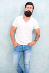 Simple and casual. Masculinity concept. Male temper brutality. Brutal macho casual outfit gray background. Fashion and beauty. Hipster long well groomed beard and mustache. Casual style daily life