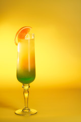 Moscow Lights cocktail in a champagne glass garnished with an orange slice